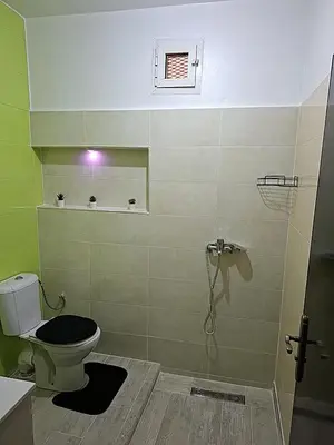 a bathroom with a toilet and a shower at Le bon coin in Casablanca
