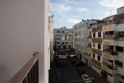 a view of a city street from a balcony at Large 2 bedroom apartment in prime location - 2 Balconies & private Parking in Rabat