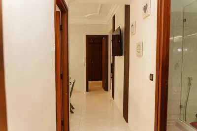 a hallway with a walk in shower and a glass door at Large 2 bedroom apartment in prime location - 2 Balconies & private Parking in Rabat