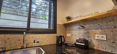 a kitchen with a counter top with a blender on it at Green Nest, Loft with private garden-Free Parking- Fast WiFi- Netflix in Casablanca