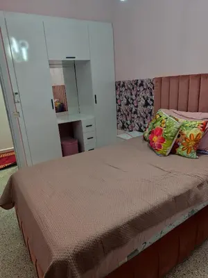 a bedroom with a bed and a mirror at Appartement a Oulad Mtaa ,Prés du stade Moulay Abdallah,Rabat in Rabat