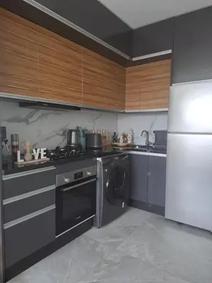 a kitchen with a stove and a dishwasher and a refrigerator at Studio luxueux CFC in Casablanca