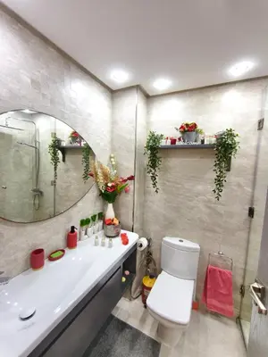 a bathroom with a sink and a toilet and a mirror at Luxueuse appartement centre ville TGV in Casablanca