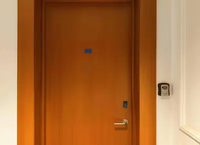 a wooden door with the number on it at Maya Suites - B LIVING CFC in Casablanca