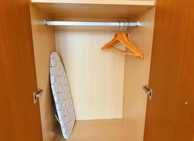 a bathroom with a door with a surfboard in it at Maya Suites - B LIVING CFC in Casablanca