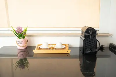 a table with a tray with two cups and a radio at Downtown Private terrace in Casablanca