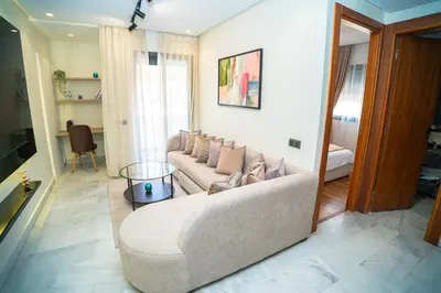 a living room with a couch and a table at Downtown Private terrace in Casablanca