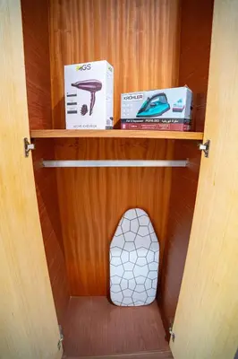 a book shelf with a dog house in a room at Downtown Private terrace in Casablanca