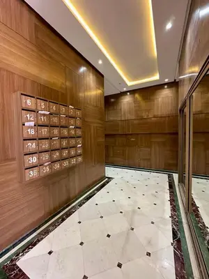 a large room with a tile floor and wooden walls at Appartement luxueux &chaleureux Agdal rabat in Rabat
