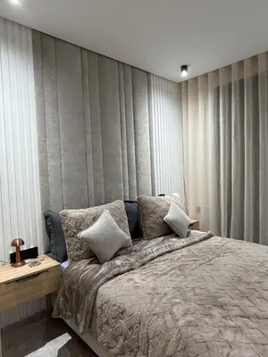 a bedroom with a bed with a wall with drapes at Premium Business Suite Heart of Casablanca in Casablanca