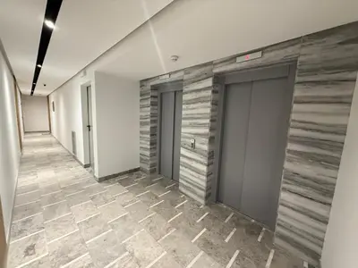 a hallway with two doors and a tile floor at Premium Business Suite Heart of Casablanca in Casablanca