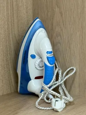 a blue and white blow dryer with a chain around it at Premium Business Suite Heart of Casablanca in Casablanca