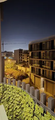 a view of a city at night from a building at EDEN Palmier in Casablanca