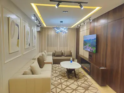 a living room with a couch and a table at Large luxurious apartment opposite to Hassan 2 Mosqu and FAIR international casablanca , near downtown prohibited arb unmarried couples, Free underground parking for buildings, 3 rooms, 2 bathroom, living room in Casablanca