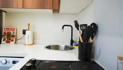 a kitchen with a sink and a counter with utensils at Maya Suites - Premium Stay - Racine in Casablanca