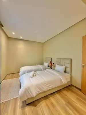 a bedroom with two beds with white sheets at Villa 2 Évasion Urbaine, 3 Chambres, à 20 min de Rabat in Sidi Yahia az Zaʼer