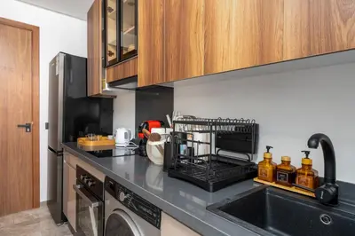 a kitchen with a sink and a dishwasher at Bright Modern Studio, Gauthier in Casablanca