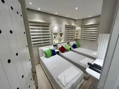 a small room with two beds in a room at Sympa appartement corniche in Casablanca