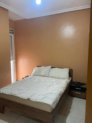 a bedroom with a bed in a room at Appartement andalous bouskoura in Bouskoura