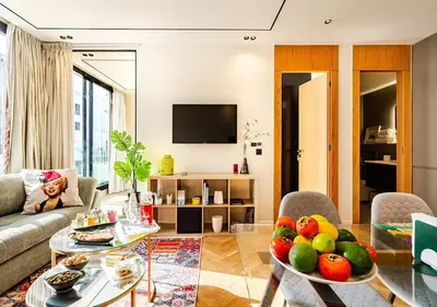 a living room with a table with fruit on it at Dynasty Estate - Appartement chic et central Yacoub Al Mansour in Casablanca