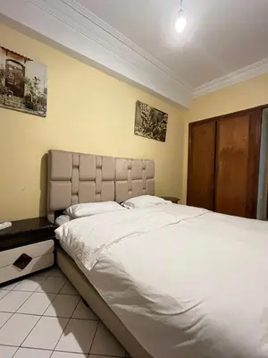 a bedroom with a large bed with white sheets at \u9526\u9ca4JinLi Villa 21 in Casablanca