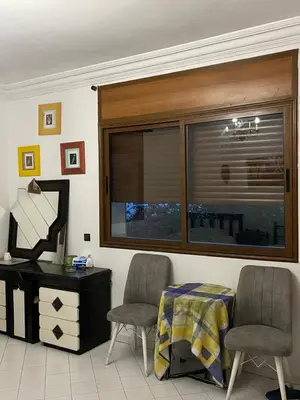 a room with two chairs and a desk and a window at \u9526\u9ca4JinLi Villa 21 in Casablanca