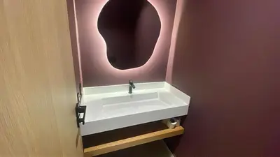 a bathroom with a sink and a mirror at Luxurious & Central Princesses in Casablanca