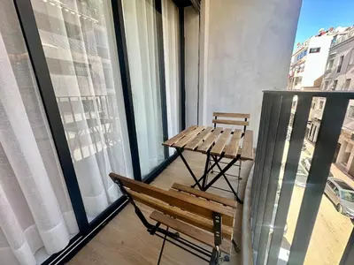 a balcony with a bench and a table on it at Luxurious & Central Princesses in Casablanca