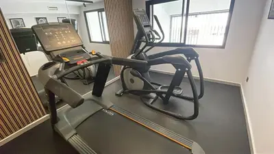 a room with a gym with a treadmill at Luxurious & Central Princesses in Casablanca