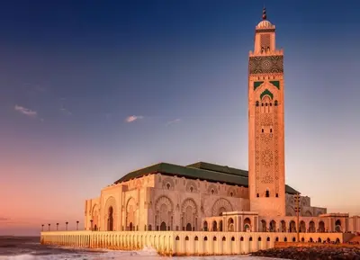 a large building with a clock tower on top at Luxurious & Central Princesses in Casablanca