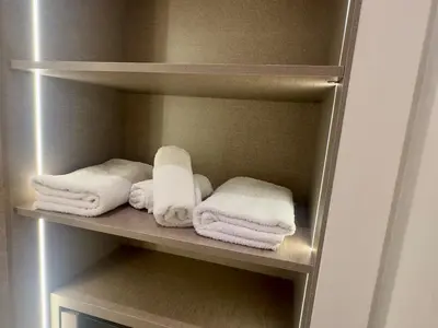 a closet with white towels on a shelf at Luxurious & Central Princesses in Casablanca