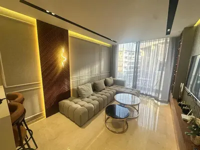 a living room with a couch and a table at Luxurious studio for princesses in Casablanca