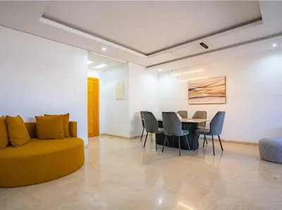 a living room with a couch and a table and chairs at Casa Contemporary 3 Beds - By AppartAli in Casablanca