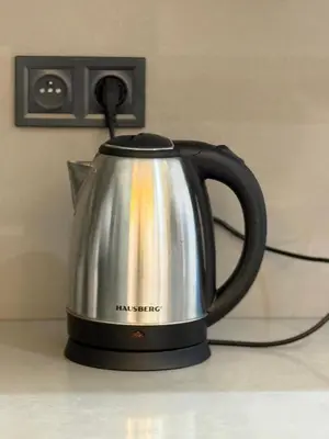 a silver and black tea kettle sitting on a counter at Luxe studio plein centre ville in Casablanca