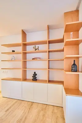 a room with wooden shelves and white cabinets at Oceanfront 2BR by Hassan II Mosque in Casablanca