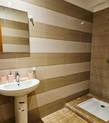 a bathroom with a sink and a mirror at Sunset Ocean View in Rabat