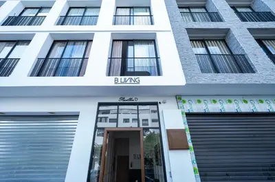 a building with a bulking sign on the facade at 1BR Private Terrace Parking Gym in Casablanca