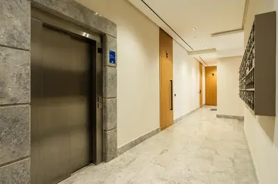 a hallway with a door in a building at Self Check In 1BR With Gym And Coworking Near CFC in Casablanca