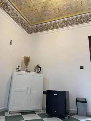 a room with a coffered ceiling and a white cabinet at Cozy getaway for a perfect stay in Rabat