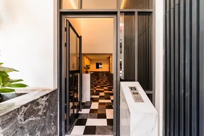 a hallway with a black and white checkered floor at Studio moderne & cosy - CFC - Maarif in Casablanca
