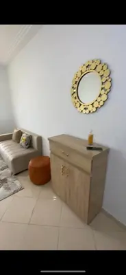 a living room with a mirror on the wall at Ouma in Casablanca