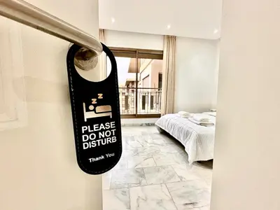 apron hanging on a door in a bedroom at Elegant apartment in Nouaceur, Close to Airport in Nouaseur