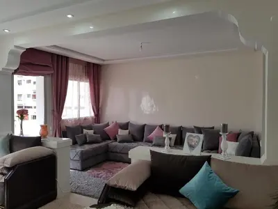 a living room with a couch and a table at Sea view Apart Rabat in Rabat