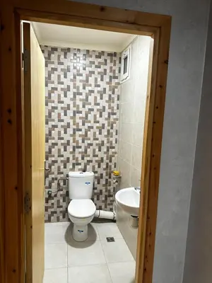 a bathroom with a toilet and a sink at Appartement central à Témara, trés proche de Rabat Av Tarik Ibn Zaid in Temara