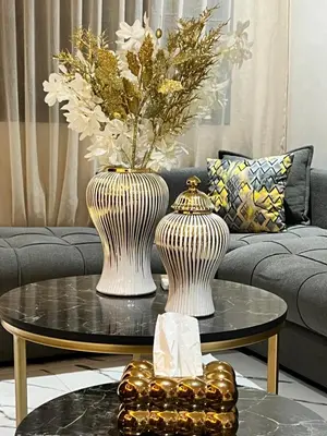 two vases on a coffee table in a living room at Studio Glamour centre ville & Casa port in Casablanca