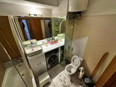 a small bathroom with a toilet and a sink at Studio Premium à Agdal , Confort et emplacement in Rabat