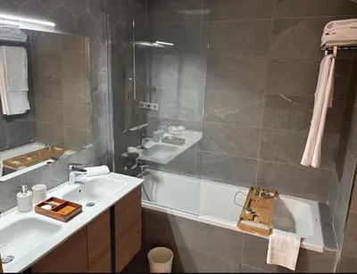 a bathroom with a sink and a shower and a tub at Carrousel Atlantic View in Rabat
