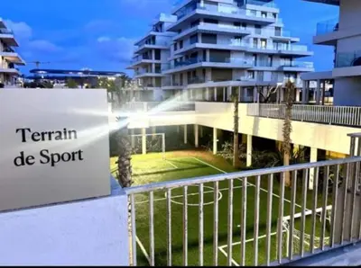 a sign on a balcony in front of a building at Carrousel Atlantic View in Rabat