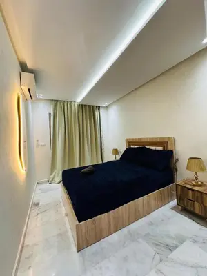 a bedroom with a large bed in a room at studio bien aménagé, ambiance chaleureuse 19 in Casablanca