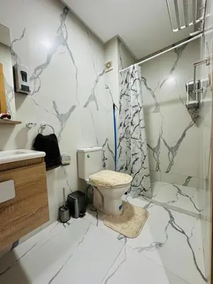 a bathroom with a toilet and a shower at studio bien aménagé, ambiance chaleureuse 19 in Casablanca